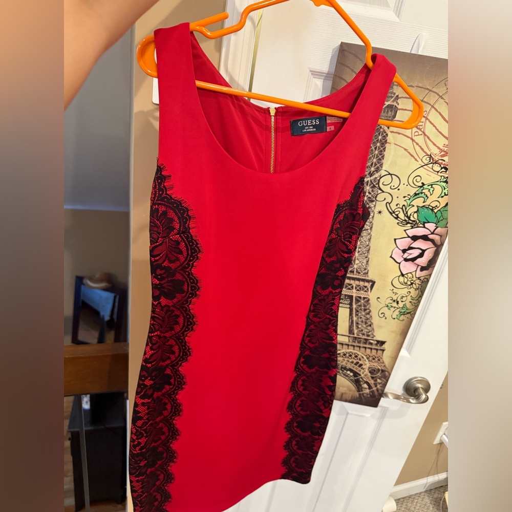 GUESS
Bright red party dress with black lace design.